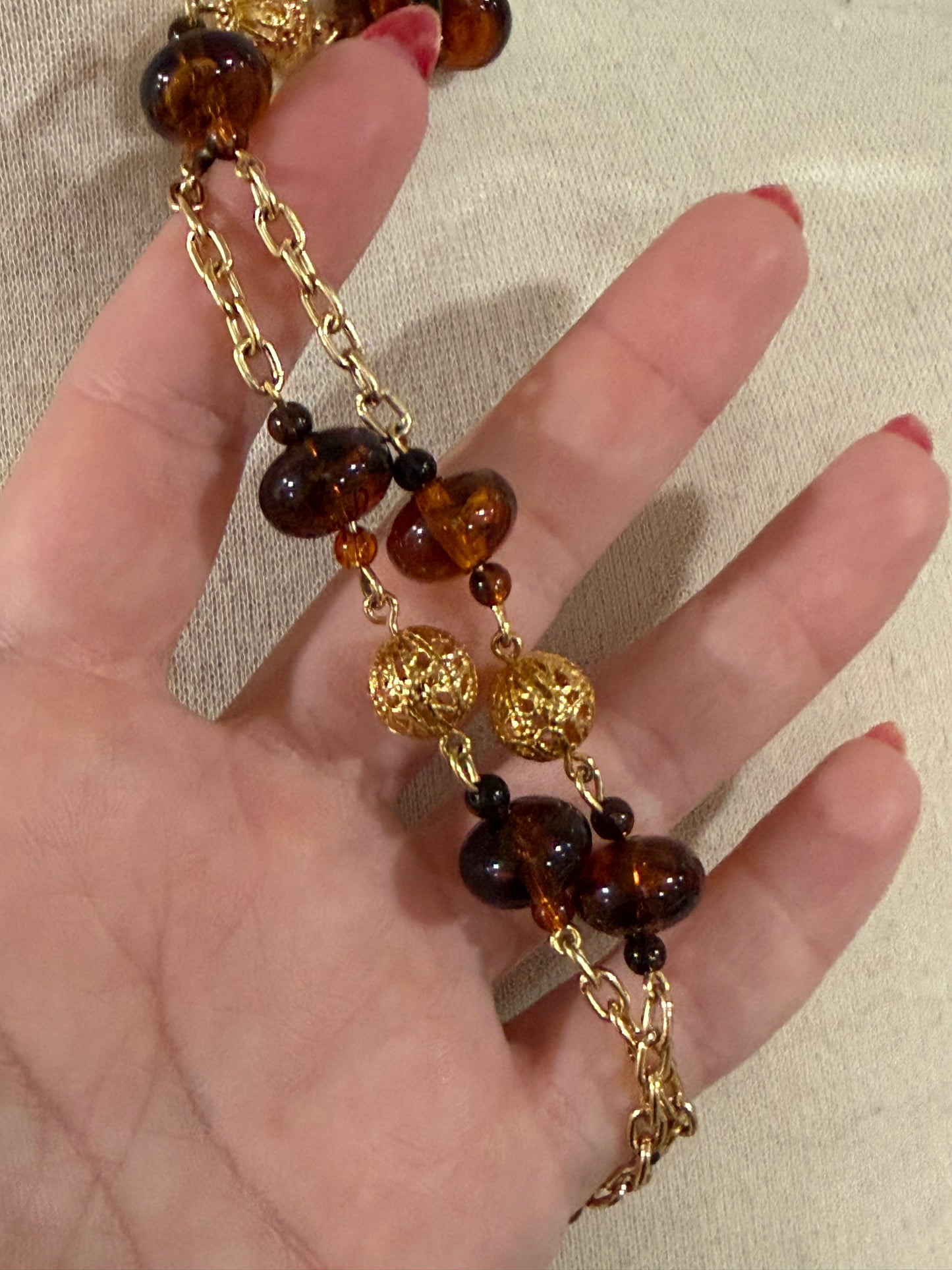 MONET BROWN, BLACK, AND ORNATE GOLD BAUBLE LONG NECKLACE