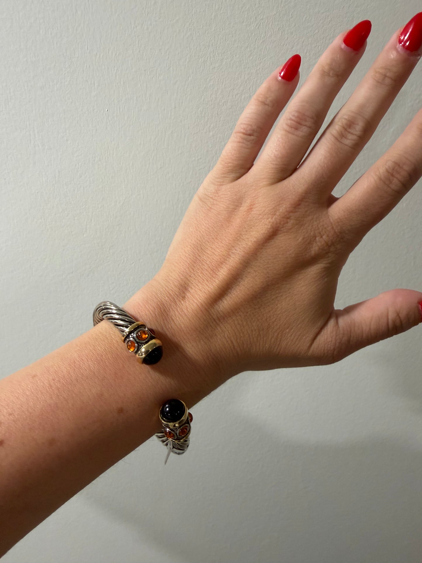 UNSIGNED SILVER WITH ORANGE FAUX GRIPOX TWISTED OPEN BANGLE