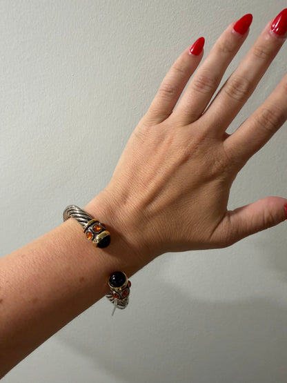 UNSIGNED SILVER WITH ORANGE FAUX GRIPOX TWISTED OPEN BANGLE
