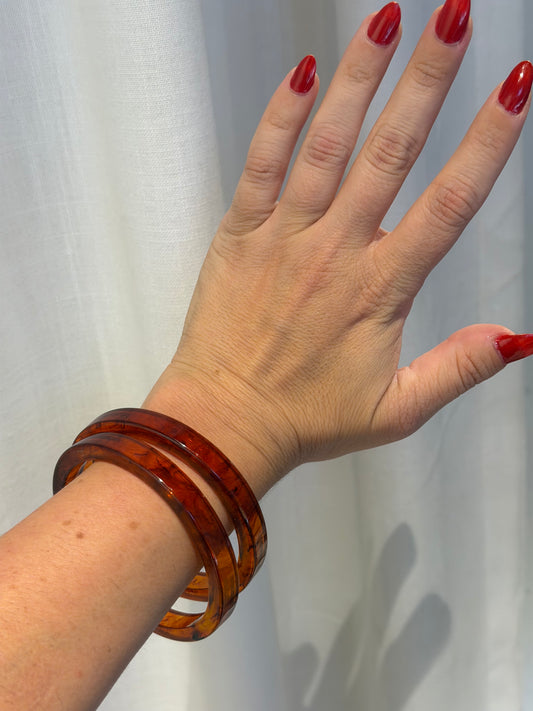 TWO FAUX TORTOISE LUCITE BANGLES
